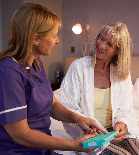 carer with lady in her home